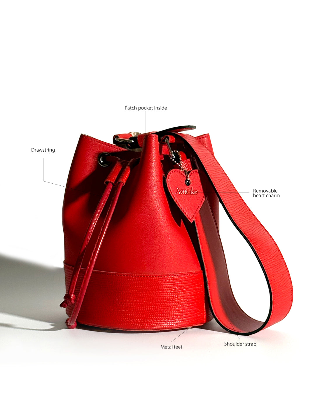 Rani bucket bag features – contrast edging, inner lining, patch pocket, bag feet | Ameiko